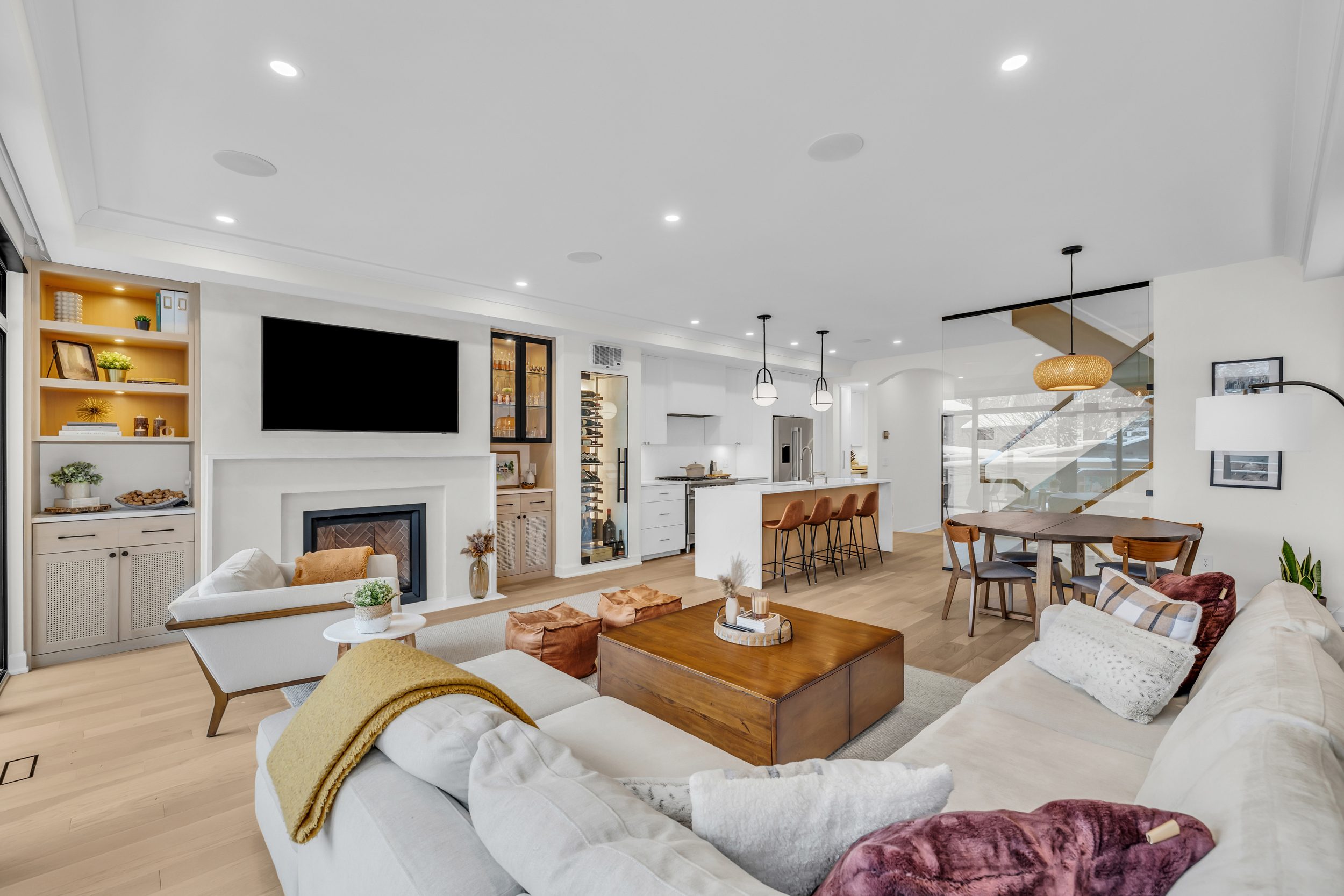 Wide open-concept living room with hardwood floors