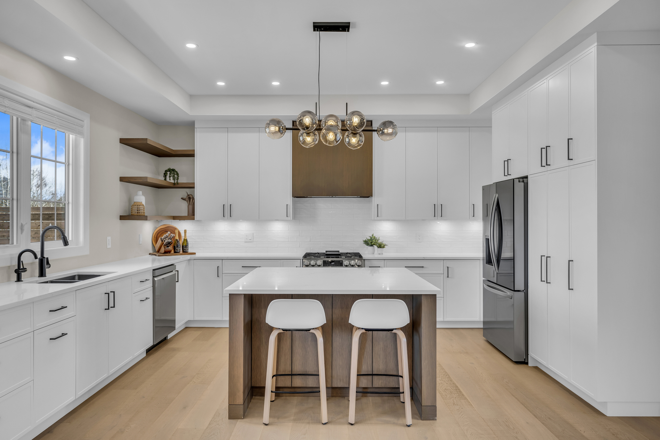 White modern kitchen with waterfall island